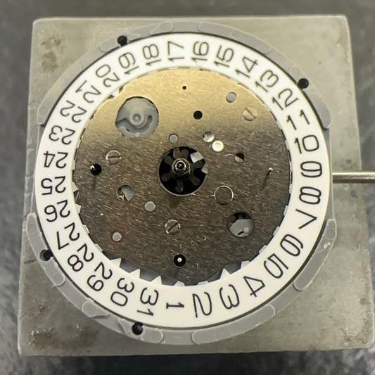 Japan Made Miyota FS23 quartz watch part with white disk, multifunctional movement for precise timekeeping.