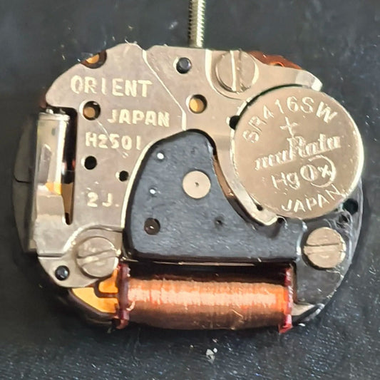 Orient Japan H2501 quartz watch part showing disassembled 3 hands movement for repair and replacement.