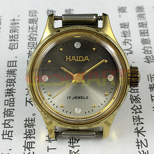Elegant SHANGHAI HAIDA lady watch with golden case, mechanical movement, and imitation diamond markers for luxury style.