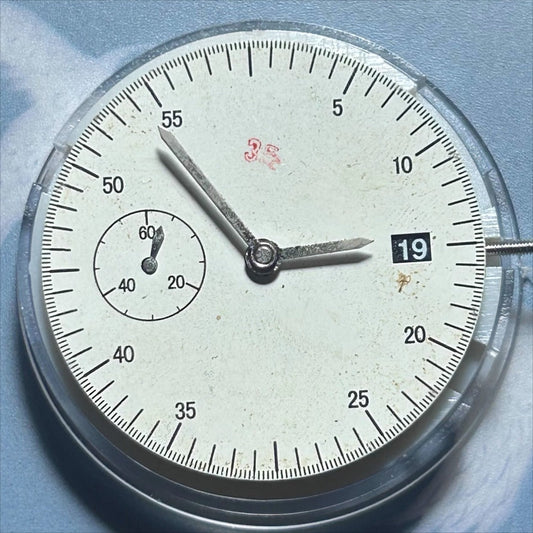 Dandong 7750 mechanical watch movement with small second at 9, date at 3, precision timepiece.
