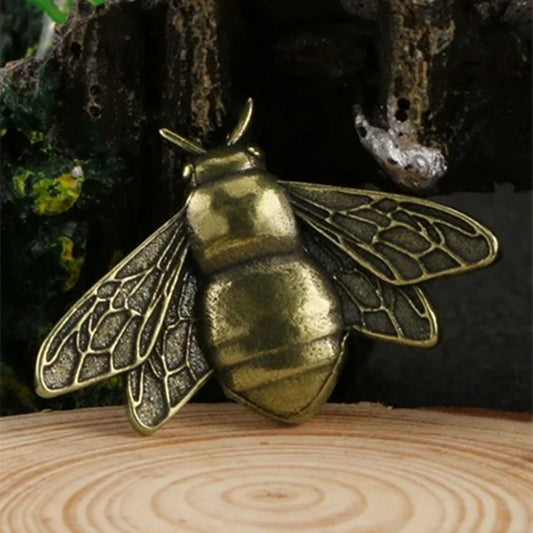 Solid copper vintage bee trinket with hand-carved details, perfect for rustic decor.