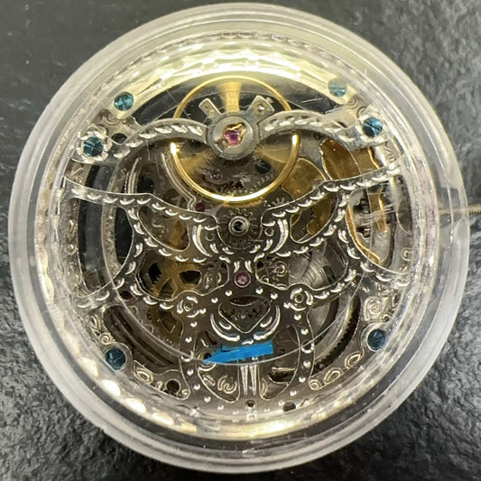Silver hollow watch with China-made Liaocheng automatic mechanical movement, small second dial at 6 o?clock, branded design.