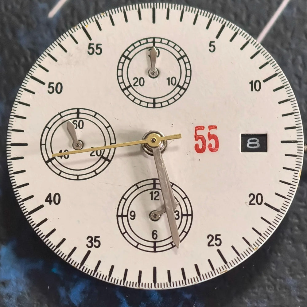 Chinese Dandong 7750 mechanical watch movement showing date at 3 and small seconds at 6, 9, and 12 positions.