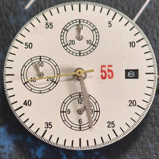 Chinese Dandong 7750 mechanical watch movement showing date at 3 and small seconds at 6, 9, and 12 positions.