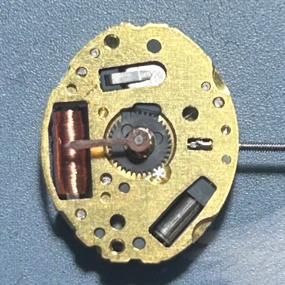 Japan-made 5Y20 quartz watch movement with 2 hands, disassembled for precise timepiece repairs.