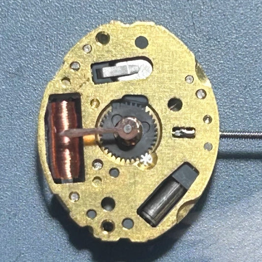 Japan-made 5Y20 quartz watch movement with 2 hands, disassembled for precise timepiece repairs.