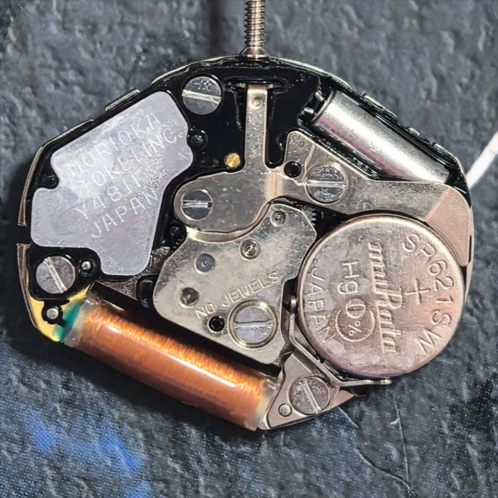 Japan Made Y481.F quartz watch part showing precise three-hand movement for smooth timekeeping.