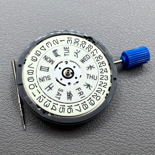 Seiko NH36A blue automatic watch crown glowing white mechanical movement detail.