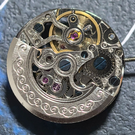 Silver hollow mechanical watch part with silver rotor, precision movement for China-made watches.