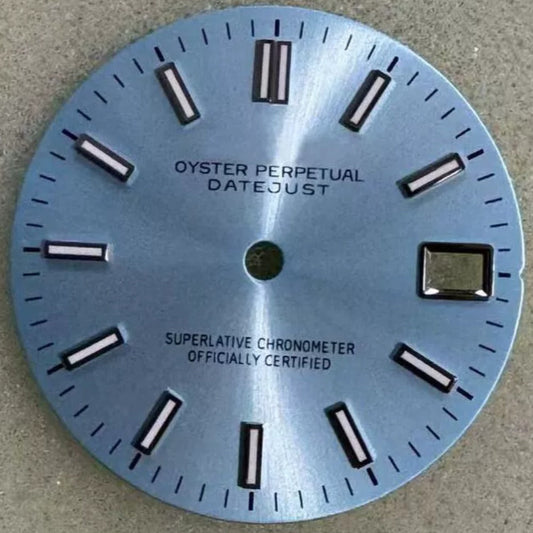 Light blue dial with silver trim and green lume for NH35 watch movement.