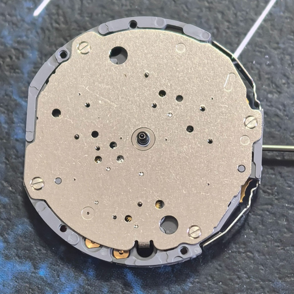Japan Made Miyota JS10 quartz watch part with small seconds at 6, 9, and 12, perfect for precise timekeeping.