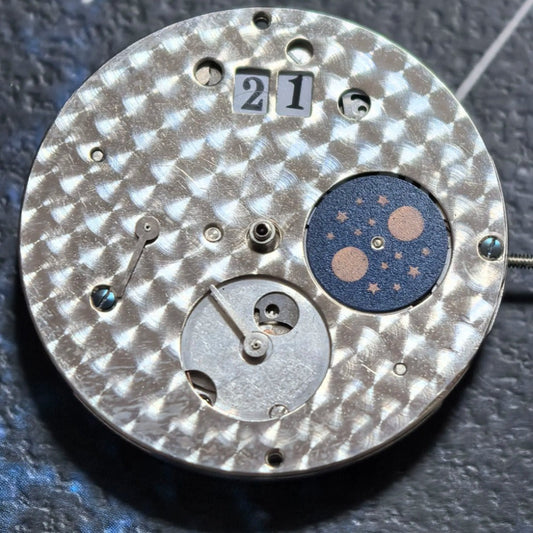 Mechanical watch part with small second at 6 and big date at 12, precision China made movement.
