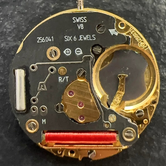 Swiss Made ETA 256.041 quartz watch movement with black dial and date at 6 o'clock, sleek design.