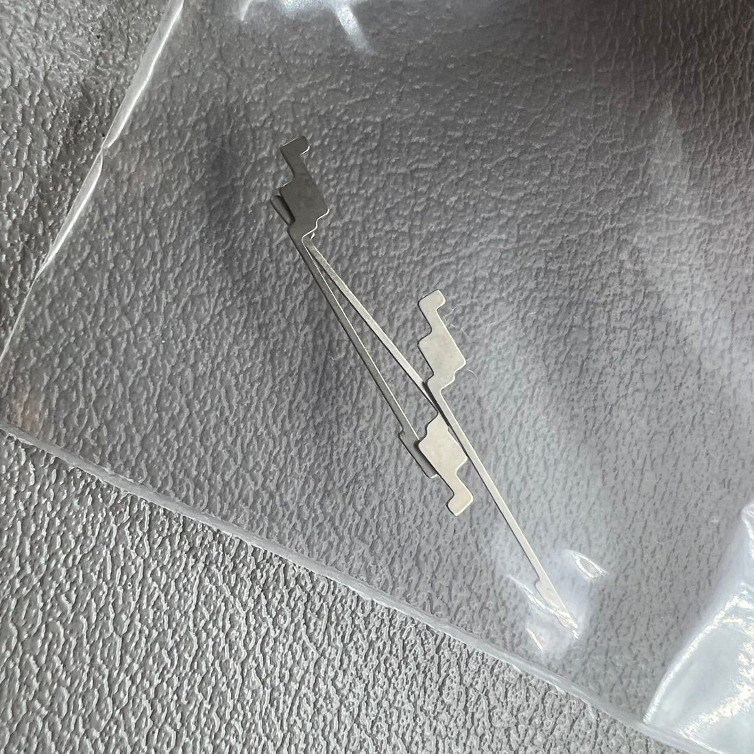 1. Two Seiko-compatible generic click springs for NH35 NH36 watch movements, ideal for repairs.