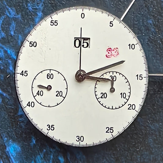 Chinese Dandong 7750 mechanical watch movement with big date at 12 and small second at 4/8, precision timepiece.
