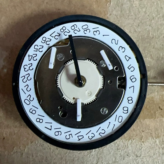 Golden watch part with Swiss Made ISA 8174 quartz movement, 6 hands, for precise timekeeping and repairs.