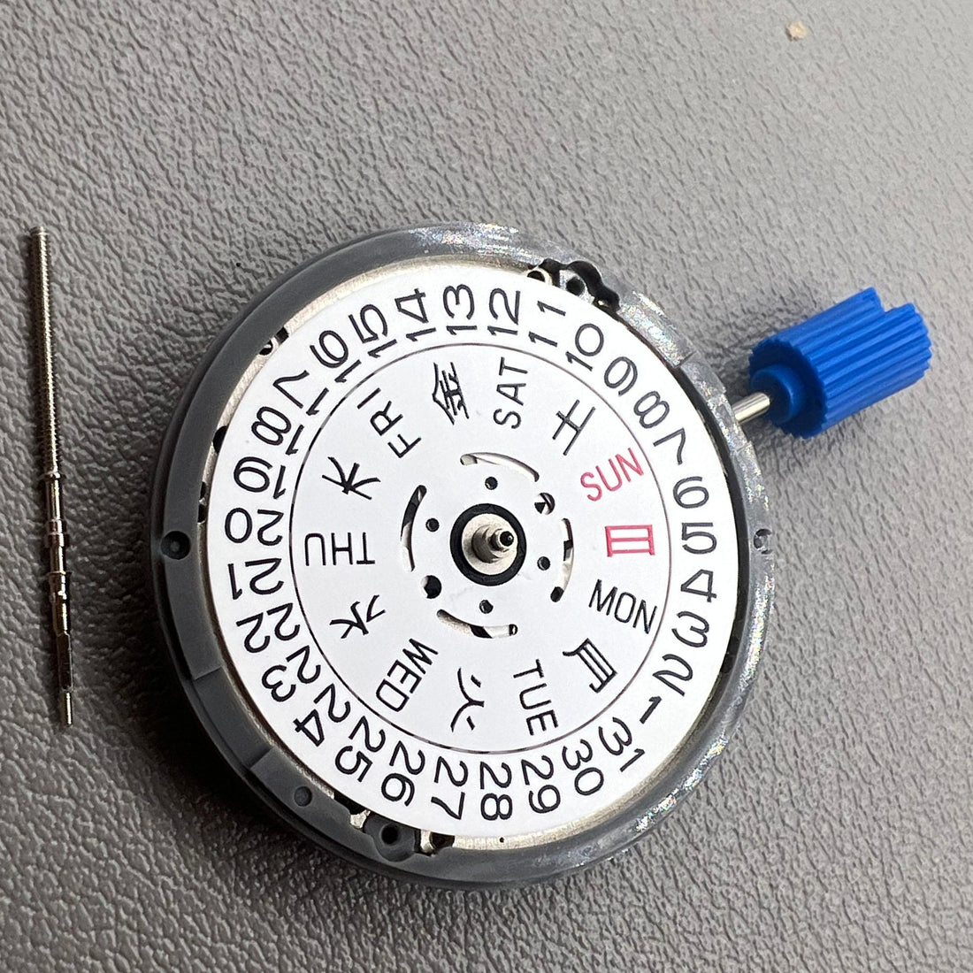 Automatic mechanical watch movement Japan NH36 with date display and crown at 3:48, precision timepiece.