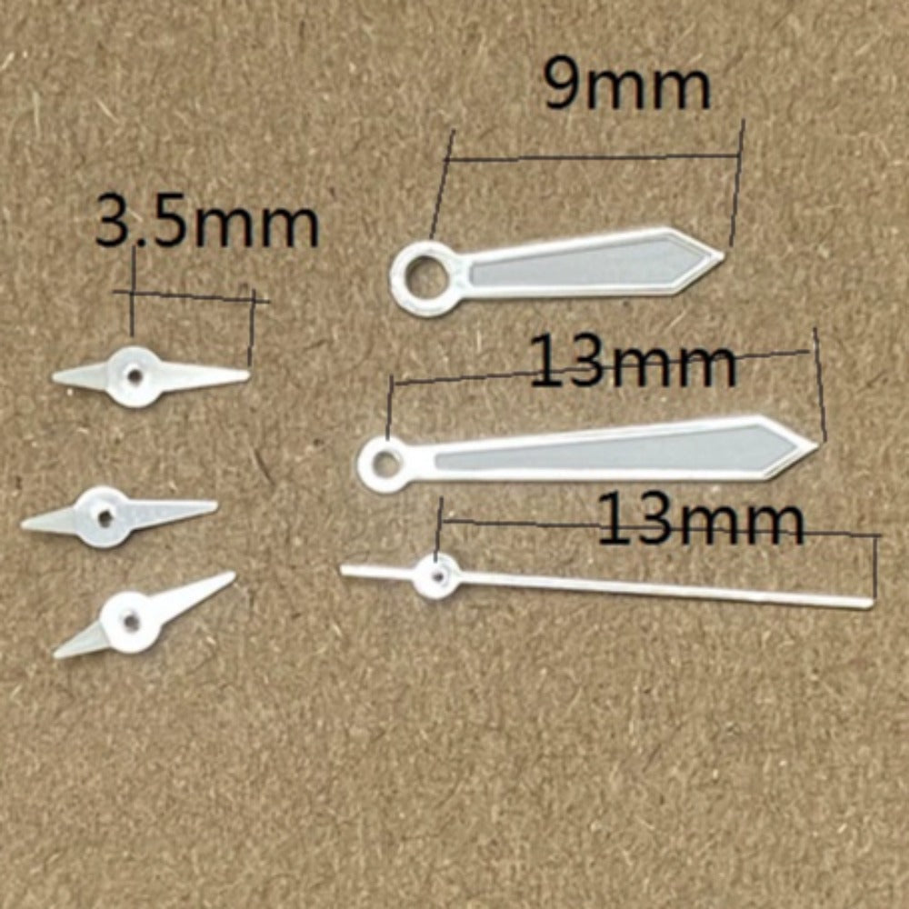 Silver-trimmed green lume arrow watch hands for Miyota JS15 quartz movement, stylish and precise.