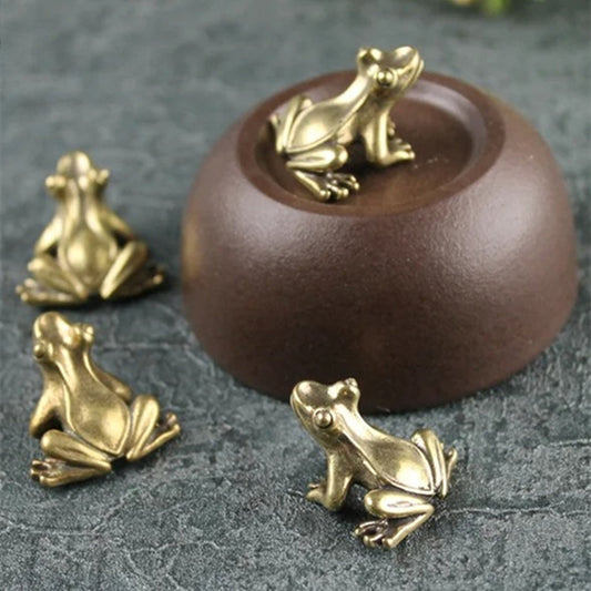 1. Three solid copper vintage frog figurines hand-carved for decor or collectibles.  