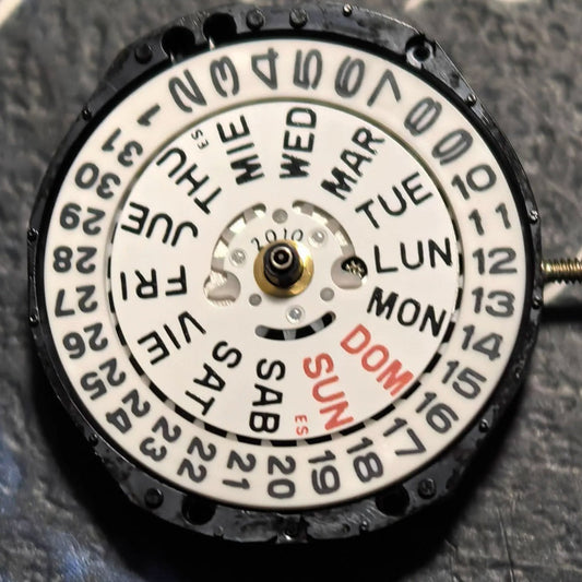 Japan Made TMI PC23A quartz watch movement with 3 hands and double calendar for precision timekeeping.