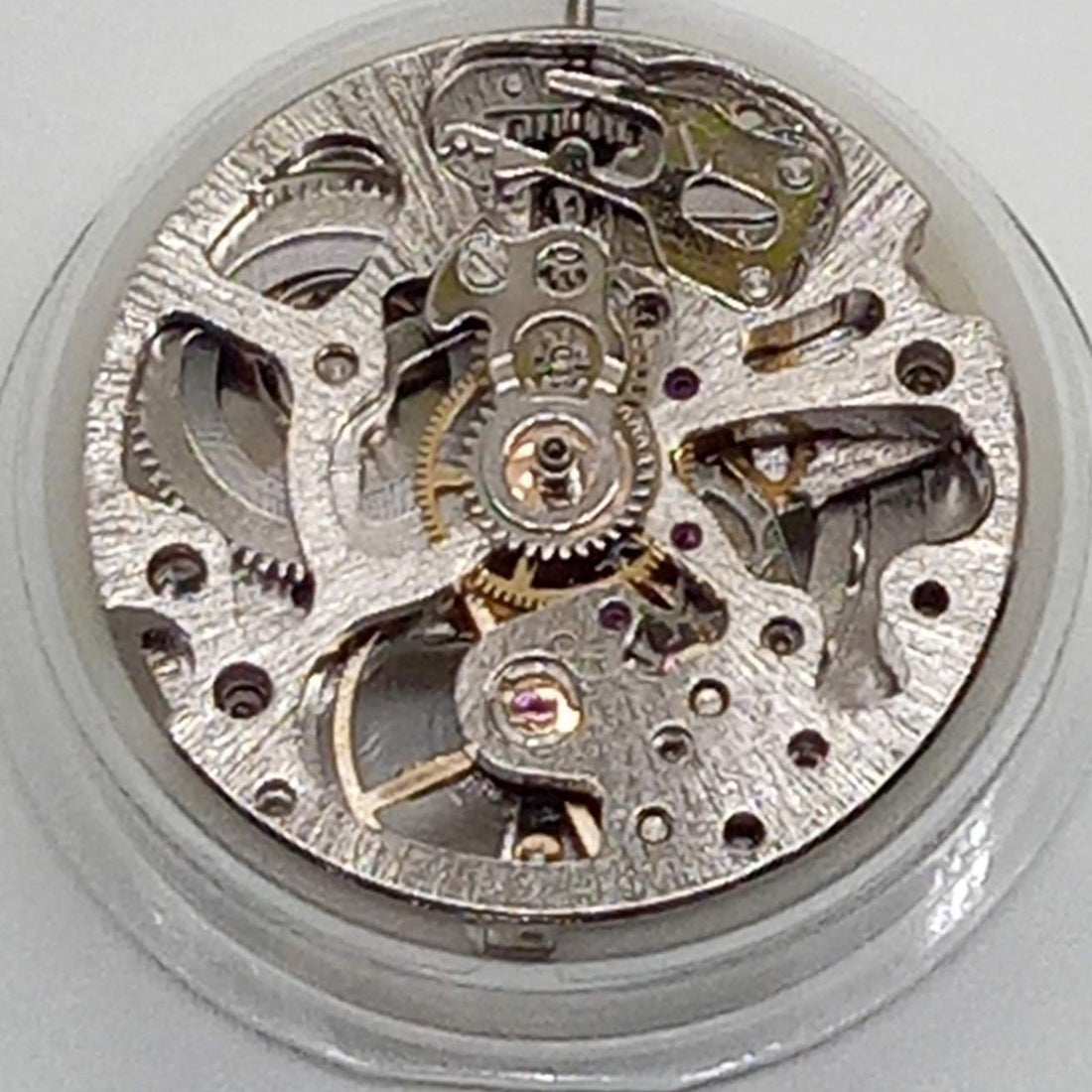 Dandong 7120 silver watch accessories showcasing mechanical movement with automatic fork detail.