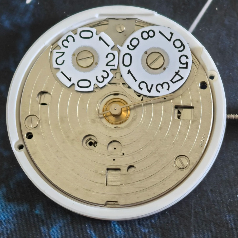 FE 7531 quartz movement watch repair part with three hands for accurate timekeeping.