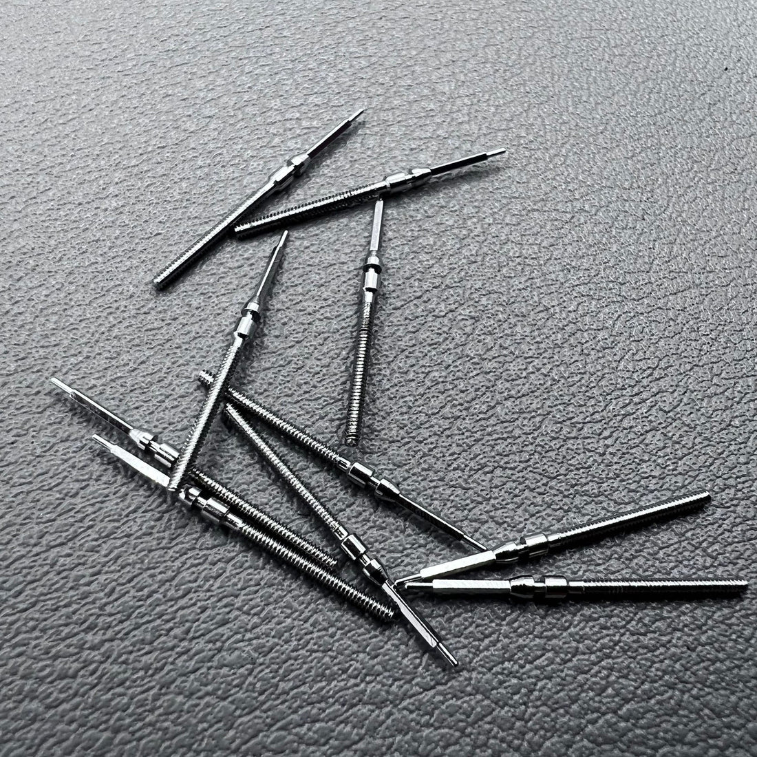 Set of 10 watch winding stems compatible with Mingzhu China 2813 and 8205 movements for repairs.