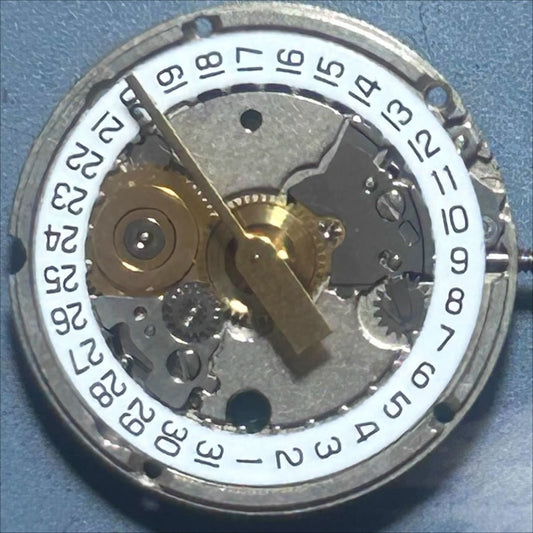 Swiss Made ETA956.114 quartz movement watch part with white disk and 3 hands for precise timekeeping.