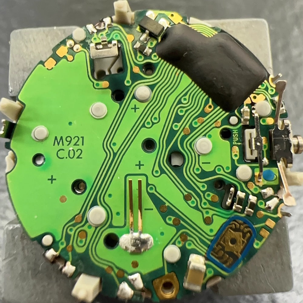 Original M921 watch part showing multifunctional movement with small seconds at 2, 6, and 10 o'clock positions.