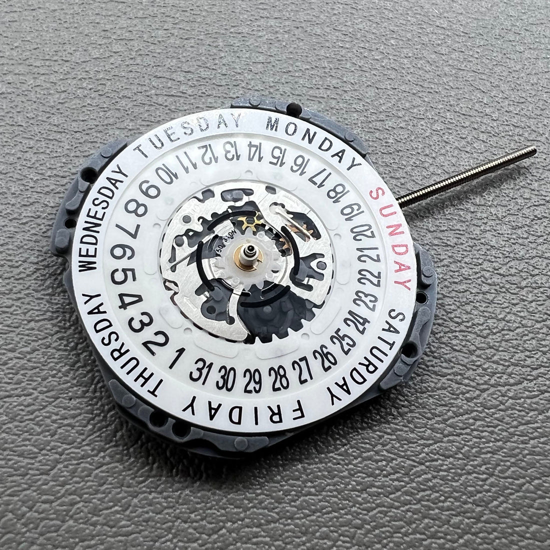 Japan Hattori Epson VJ45B quartz watch movement with date at 6 o'clock and day display at 12, precise timekeeping.