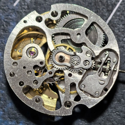 China Made Hollow 7120 mechanical watch part with golden rotor for precise timekeeping.