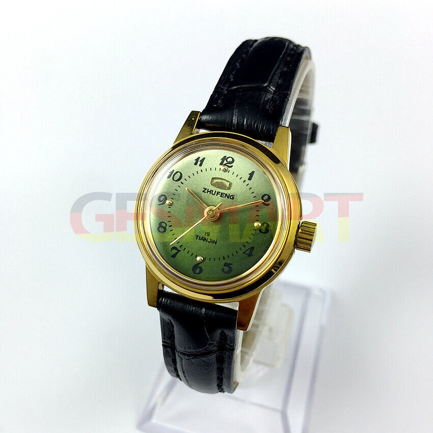 Zhufeng ladies watch with round case and three hands, manual mechanical movement, green dial background.