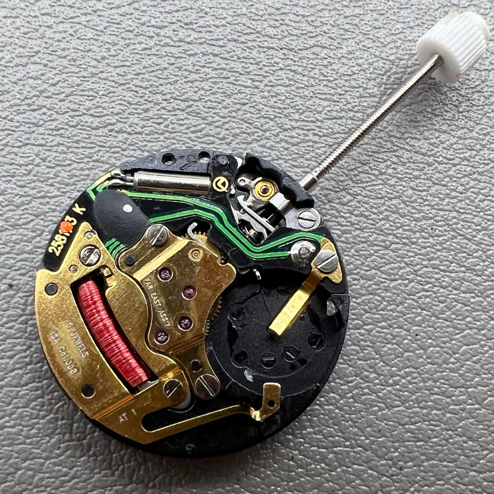 Swiss ISA 338 quartz watch movement with date at 6 o'clock and three hands, ideal for watch accessories.