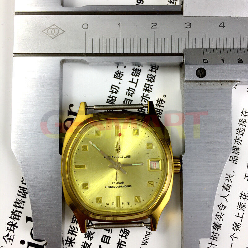 Old Stock Dandong manual mechanical watch with 17 jewels, golden dial, and single calendar for classic style.