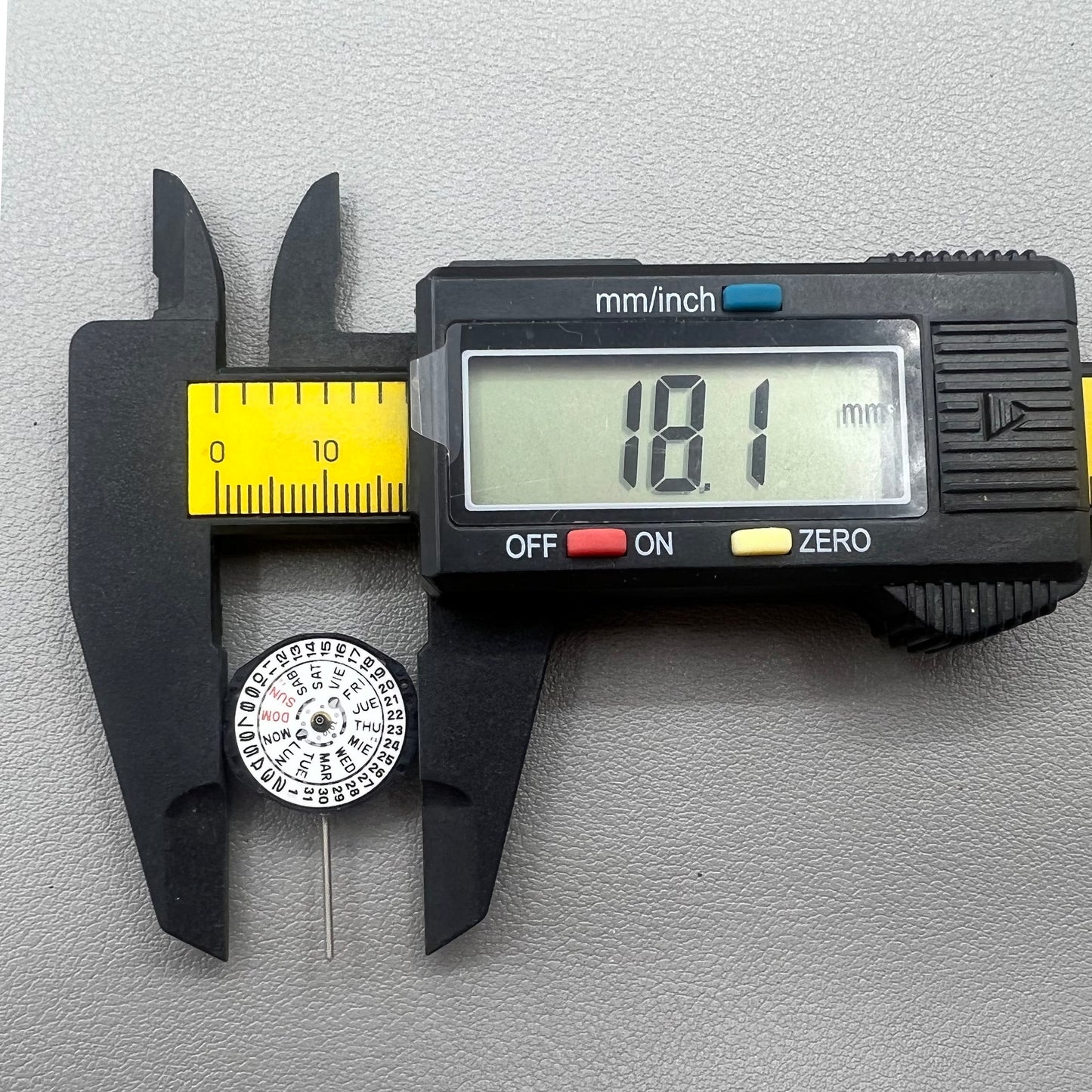 Japan PC23A Quartz watch movement showing 3 hands and double calendar functionality for precise timekeeping.