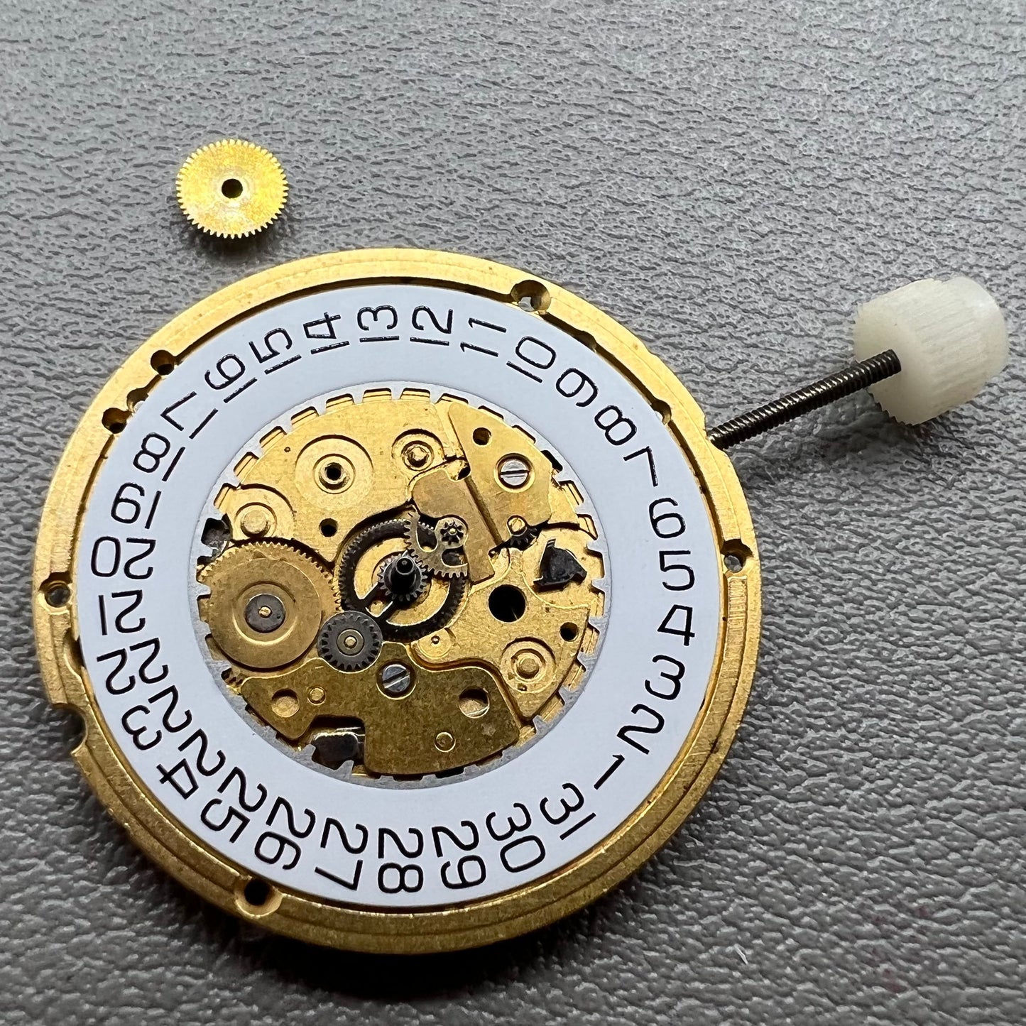 Swiss ETA255.412 quartz watch movement with 3 hands and white dial, precision craftsmanship by ETA.