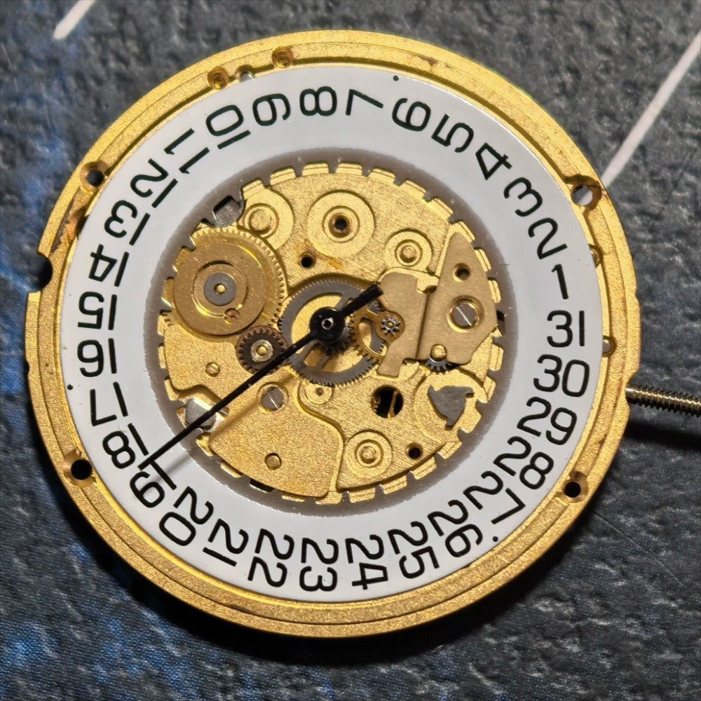 Swiss Made ETA255.411 quartz movement watch part with white dial, 3-hand design for precise timekeeping.