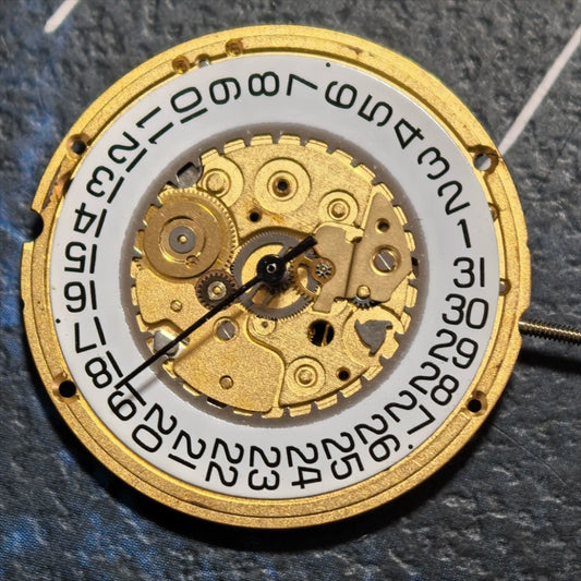 Swiss Made ETA255.411 quartz movement watch part with white dial, 3-hand design for precise timekeeping.