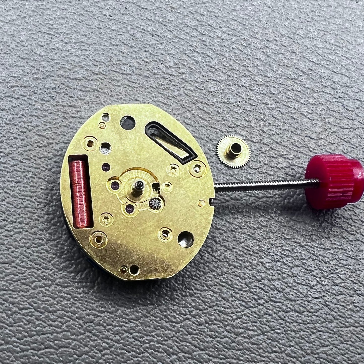 Close-up of Swiss ETA 980.103 quartz watch movement showcasing precision engineering and reliability.