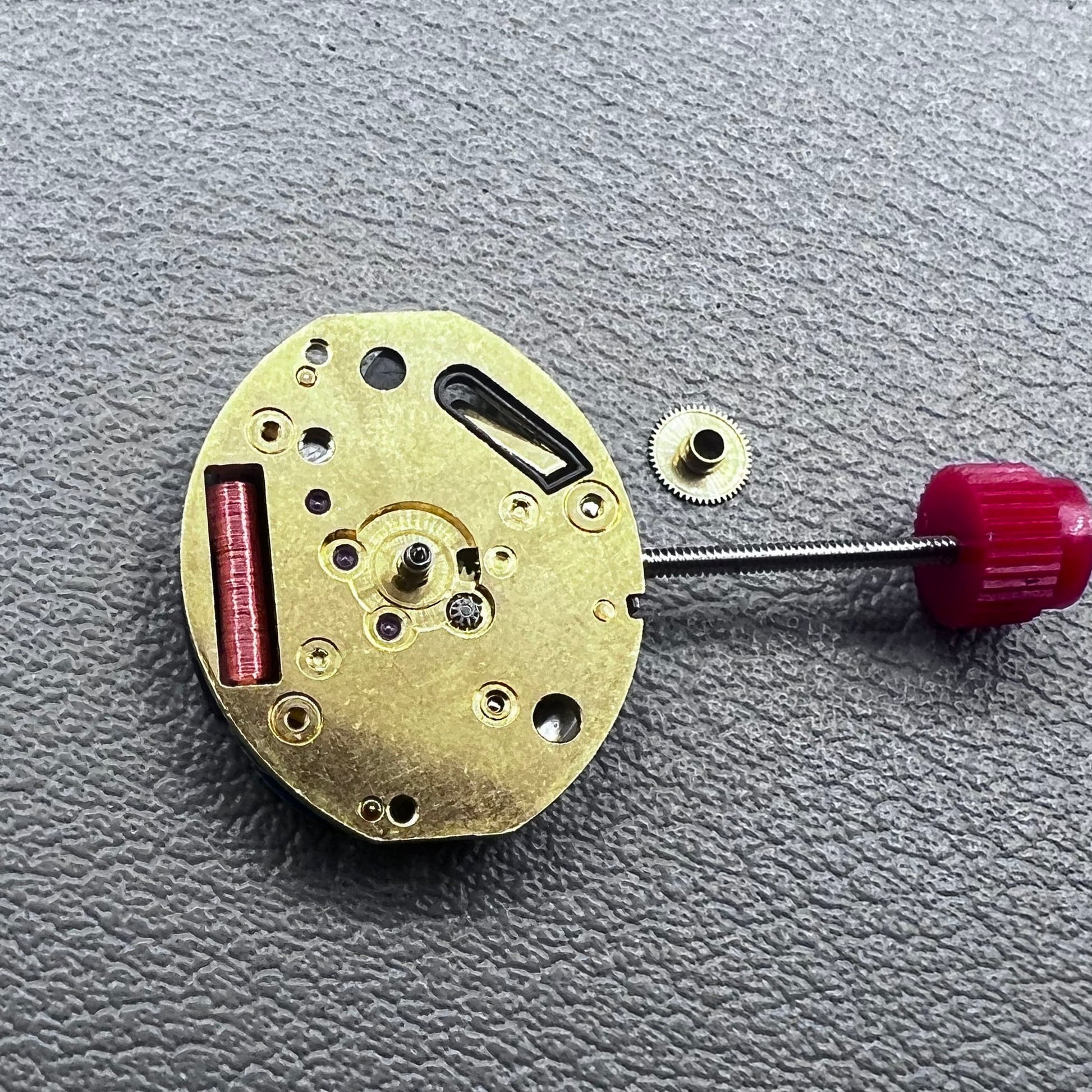 Close-up of Swiss ETA 980.103 quartz watch movement showcasing precision engineering and reliability.