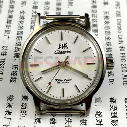 32mm Shanghai Factory manual mechanical watch with silver case and silver nail hands, classic style.