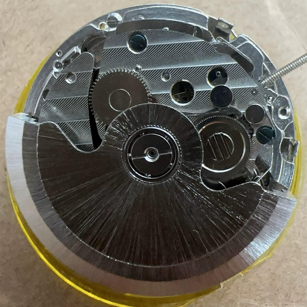 China Made ST10 2393 mechanical watch movement with small seconds and date display at 3, 6, and 9 o?clock positions.