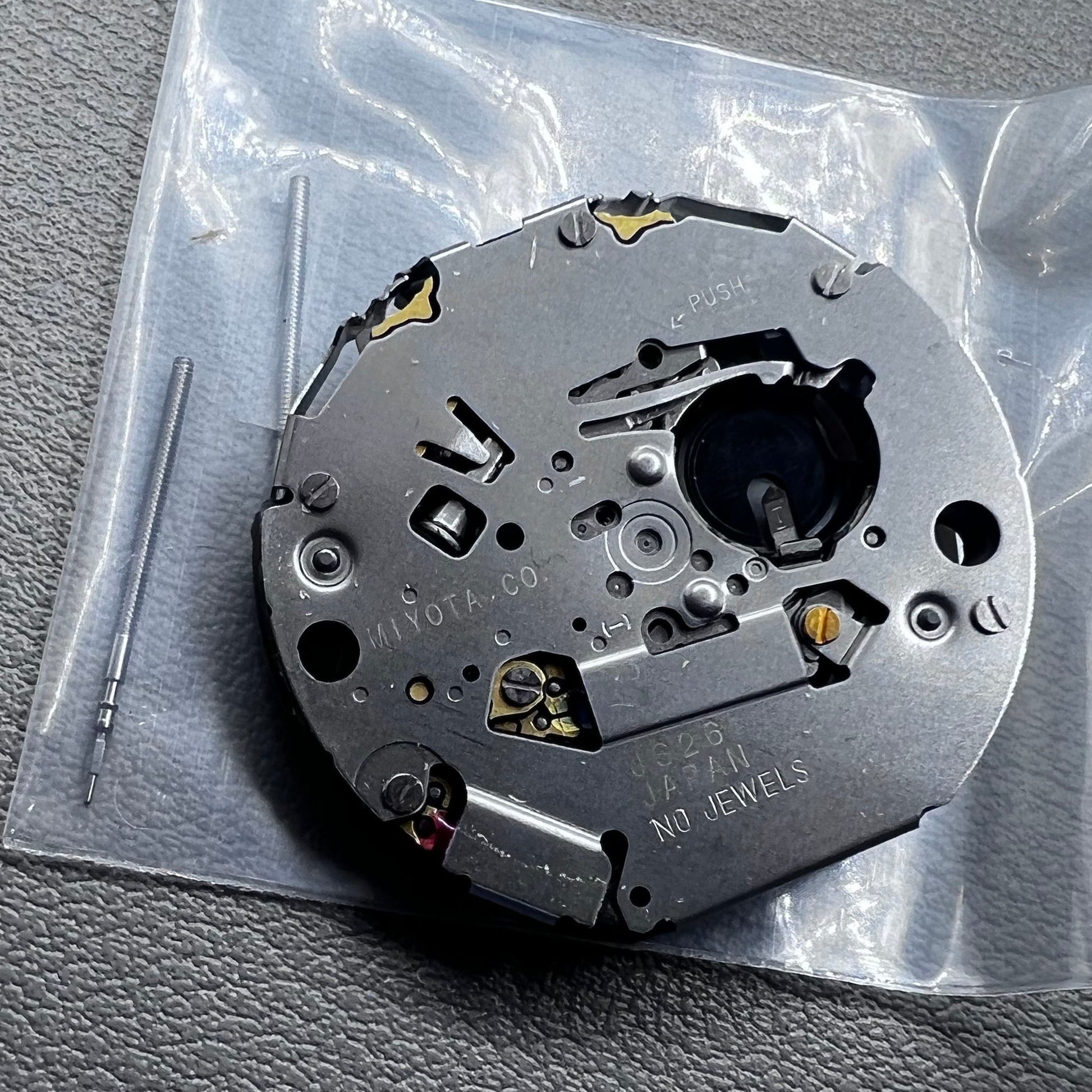 Japan Miyota JS26 watch quartz movement with date at 3 o'clock and small seconds at 6 and 9 markers