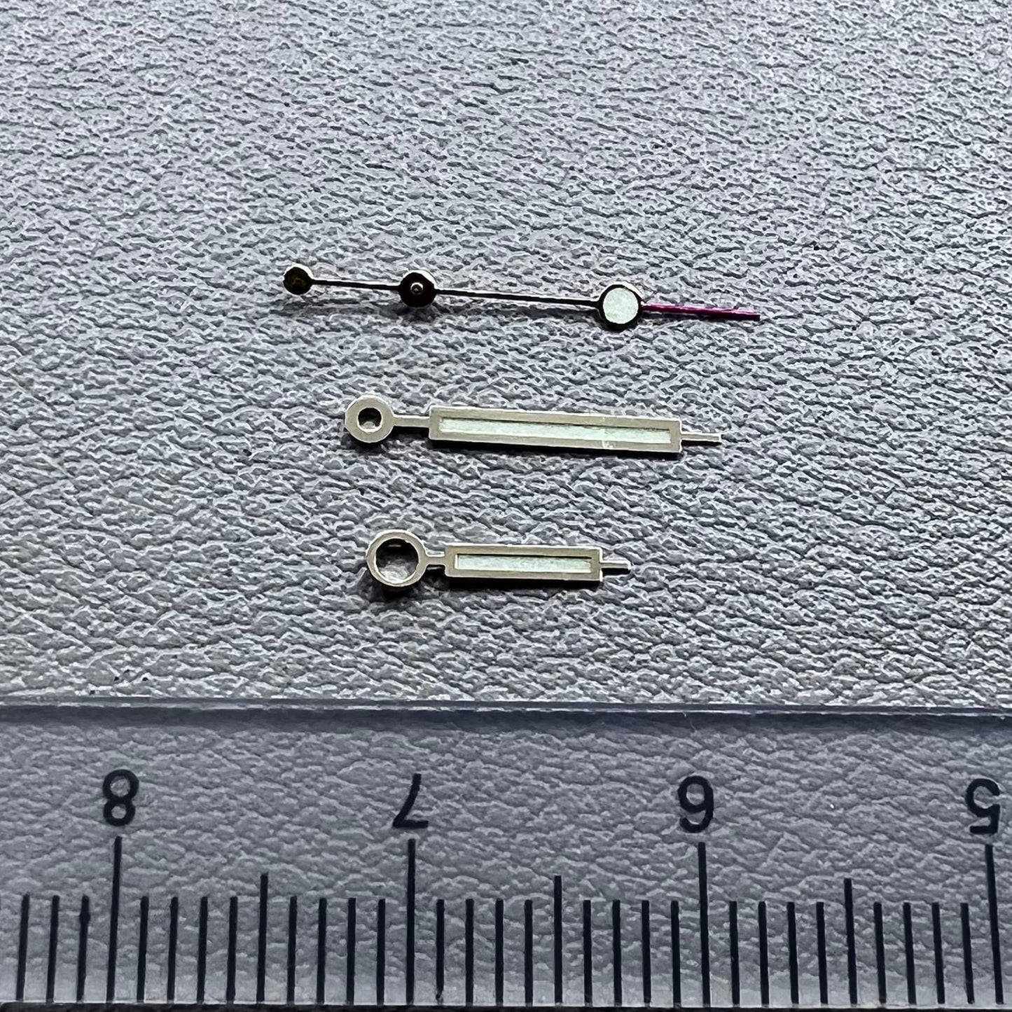 Green luminous watch hands with golden trim for NH35 NH36 movements, enhancing visibility and style.