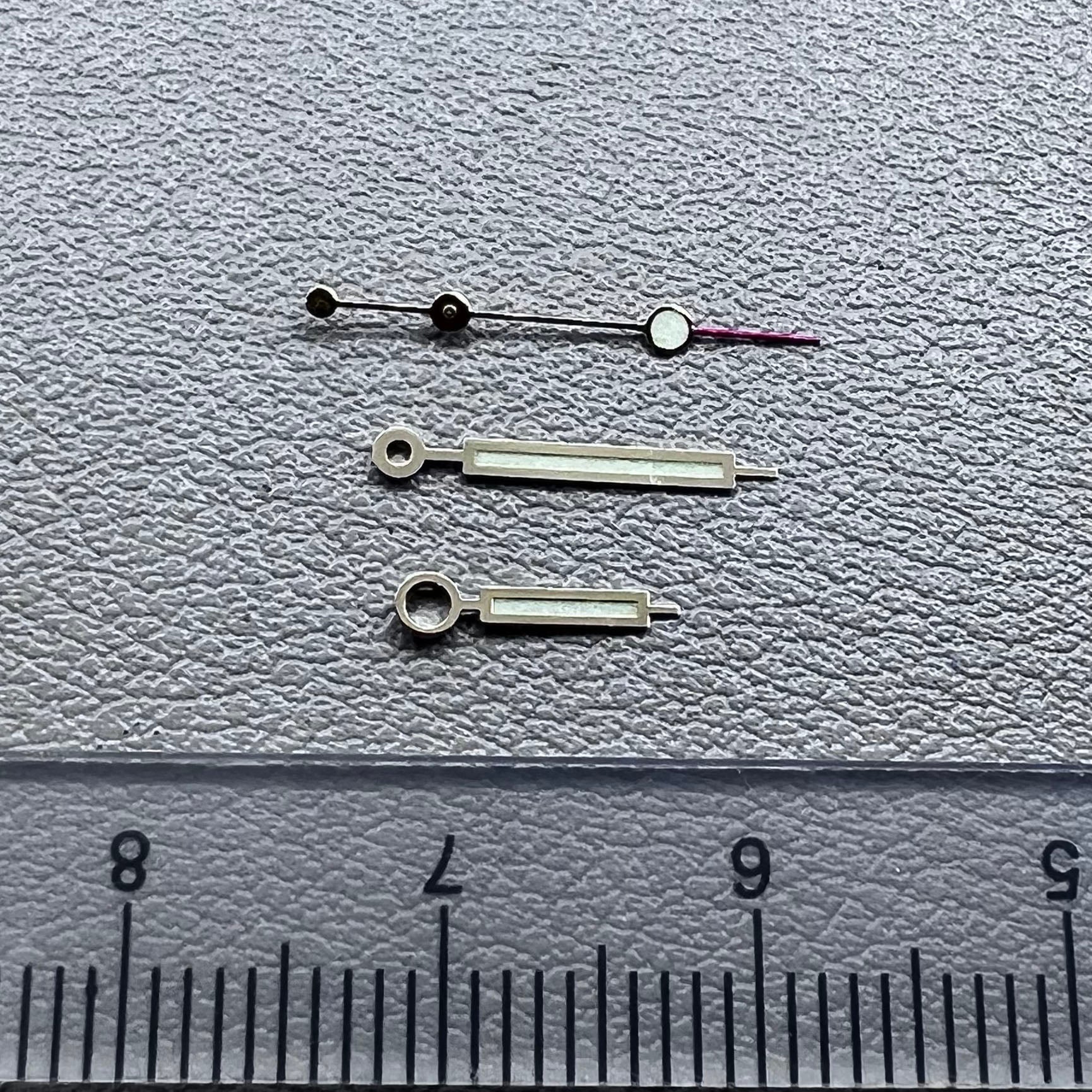 Green luminous watch hands with golden trim for NH35 NH36 movements, enhancing visibility and style.