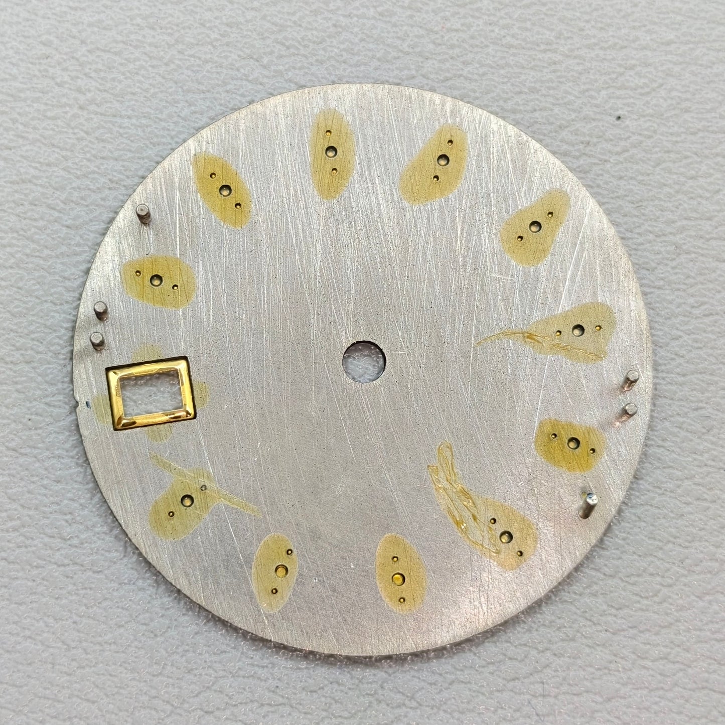 watch dial with S logo