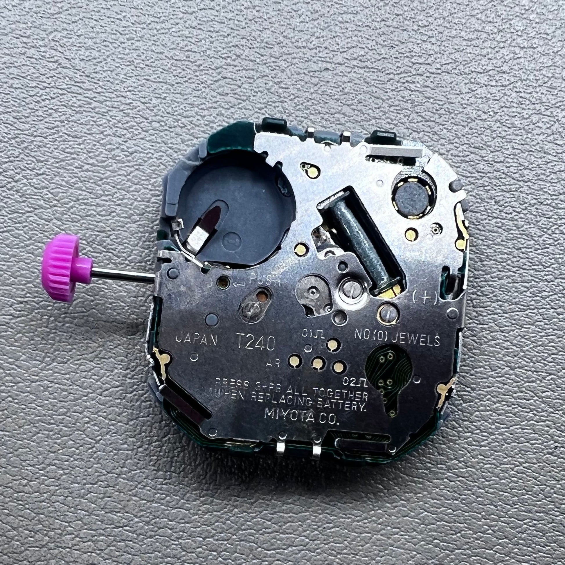 Japan T240 quartz watch movement with 3 hands and digital display, perfect for precise timekeeping accessories.