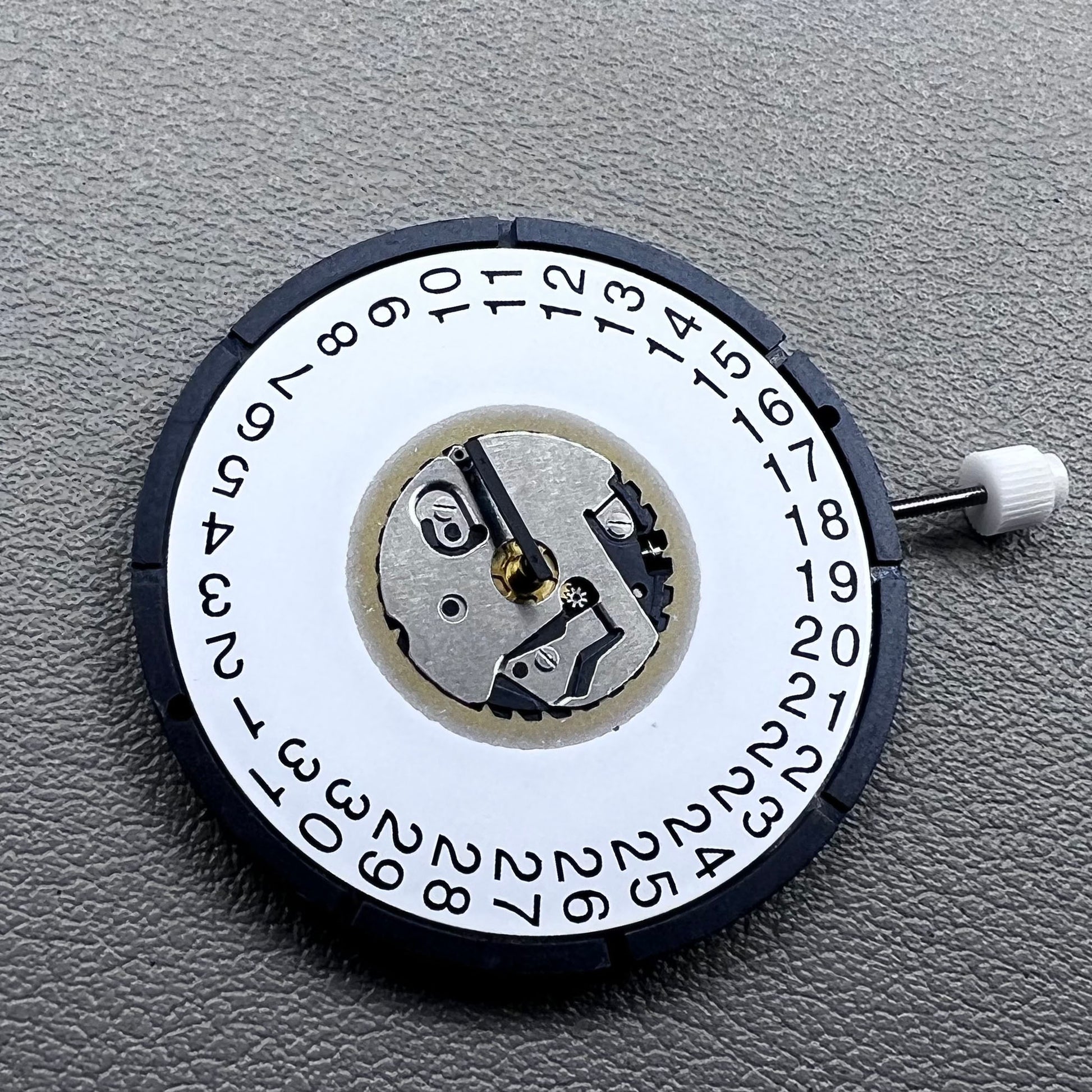Swiss ISA 2334 quartz watch movement with date at 3 o?clock, precise timekeeping by Swiss ISA.