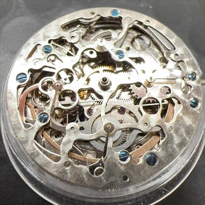 Silver hollow watch part with Hangzhou 2189 automatic movement, China-made for precise mechanical repair.