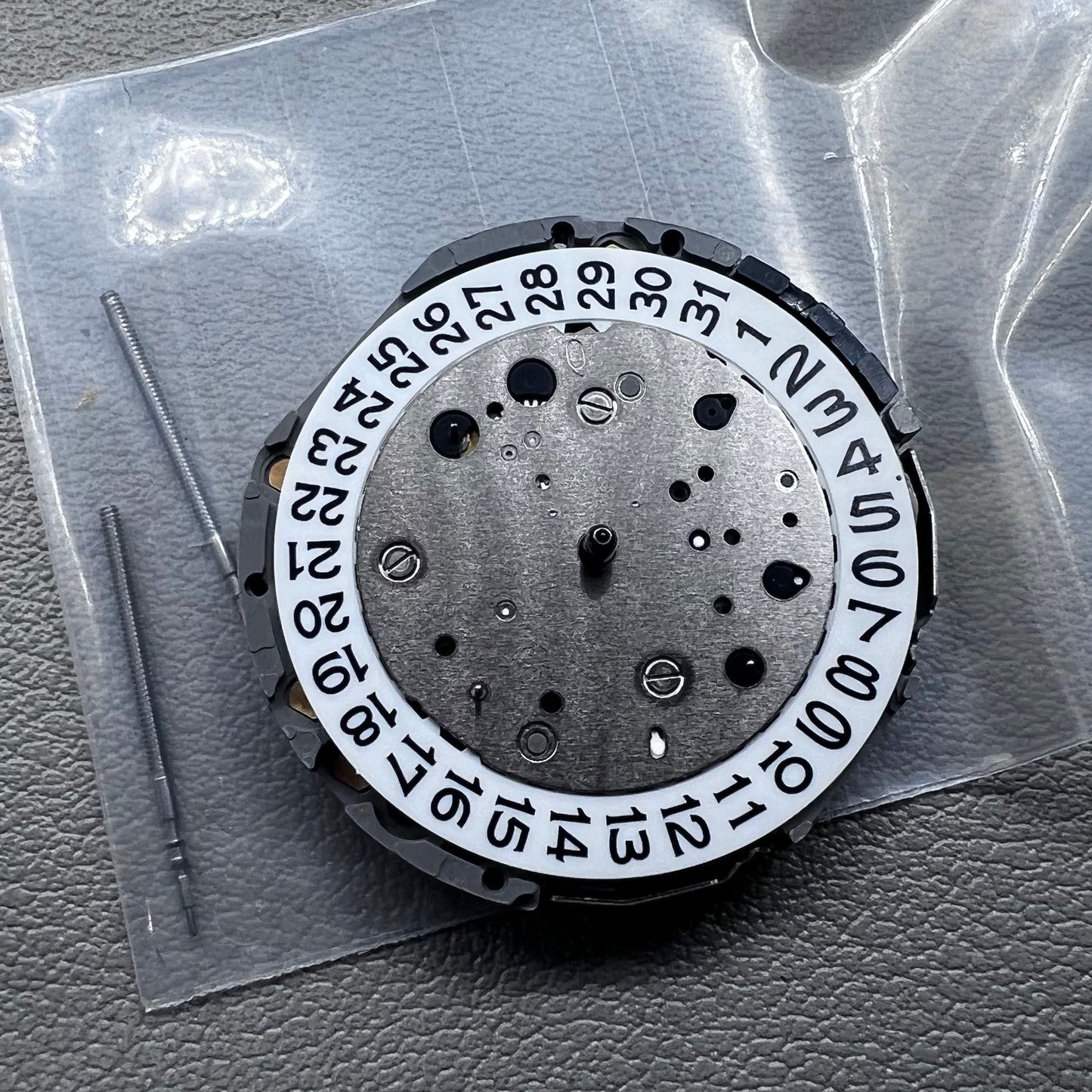 Japan Miyota JS26 watch quartz movement with date at 3 o'clock and small seconds at 6 and 9 markers